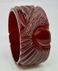 vintage wide cherry amber or wine translucent sunrise or comet carved bakelite bangle